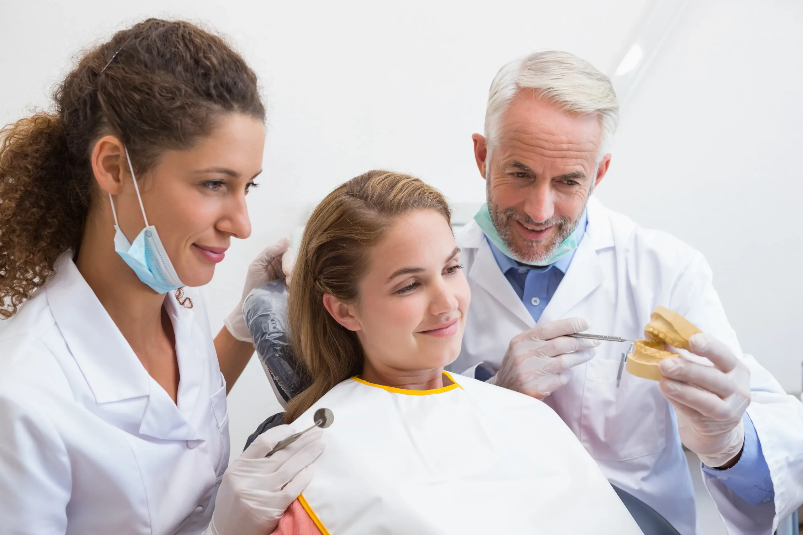 Dentists discussing about the dental procedure